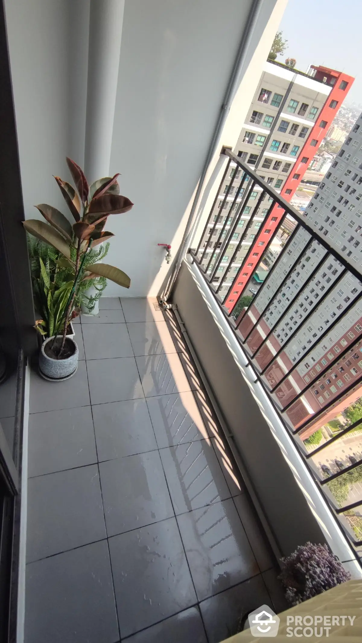 Modern balcony with city view, perfect for relaxation and enjoying urban scenery.