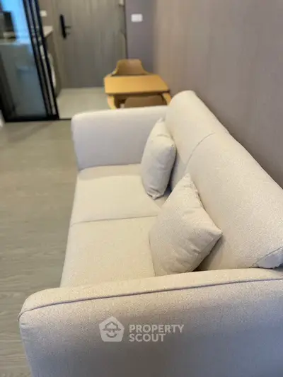 Modern living room with beige sofa and stylish decor