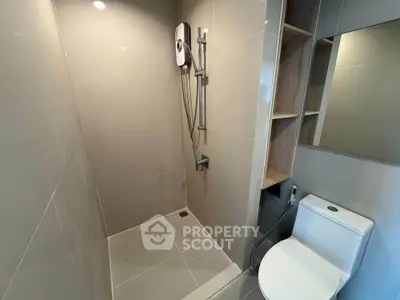 Modern bathroom with sleek shower and toilet in contemporary apartment