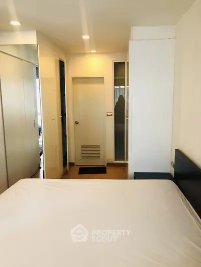 Modern bedroom with sleek design and ample natural light