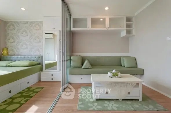 Modern studio apartment with stylish decor and sliding glass partition.
