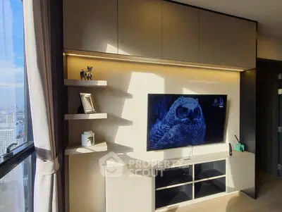 Modern living room with large window and sleek TV setup