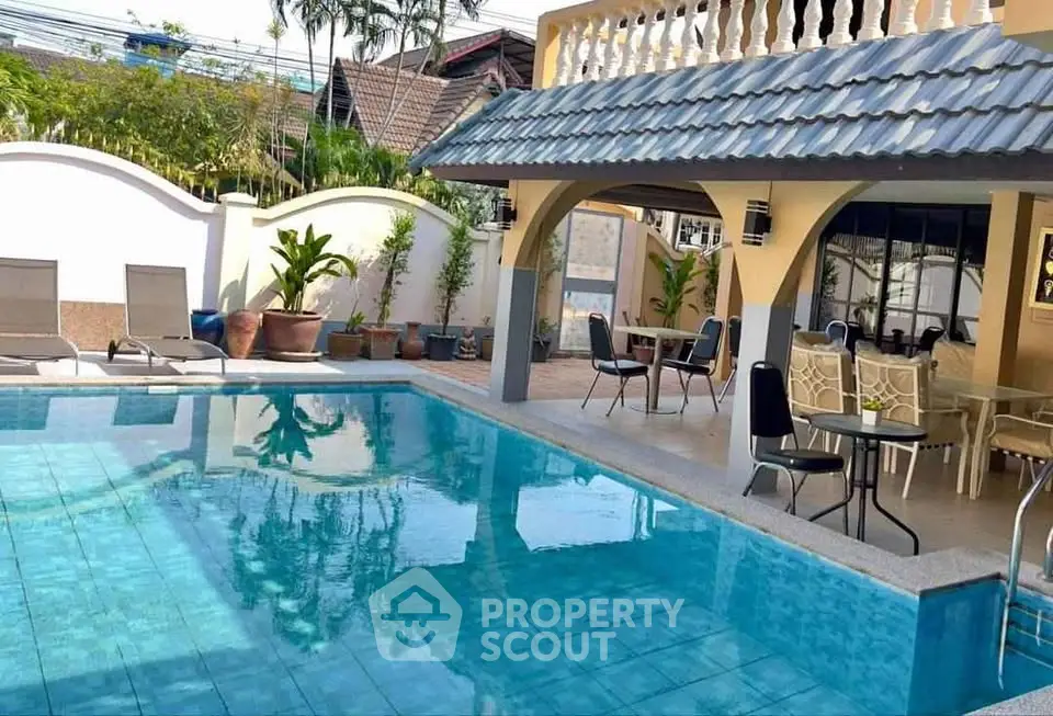 Luxurious villa with private pool and spacious outdoor seating area, perfect for relaxation and entertainment.