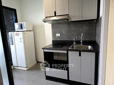 Modern kitchen with sleek cabinetry and stainless steel appliances
