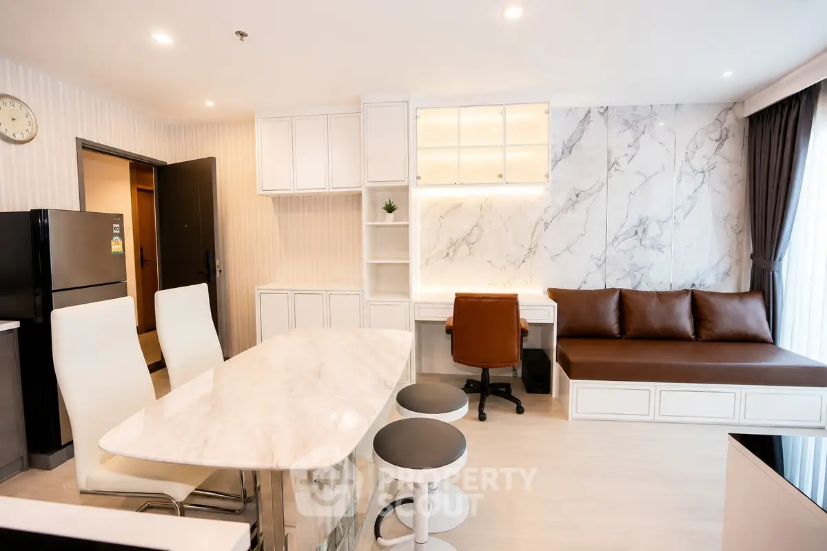 Modern living room with marble accents and stylish furniture in a luxury apartment.