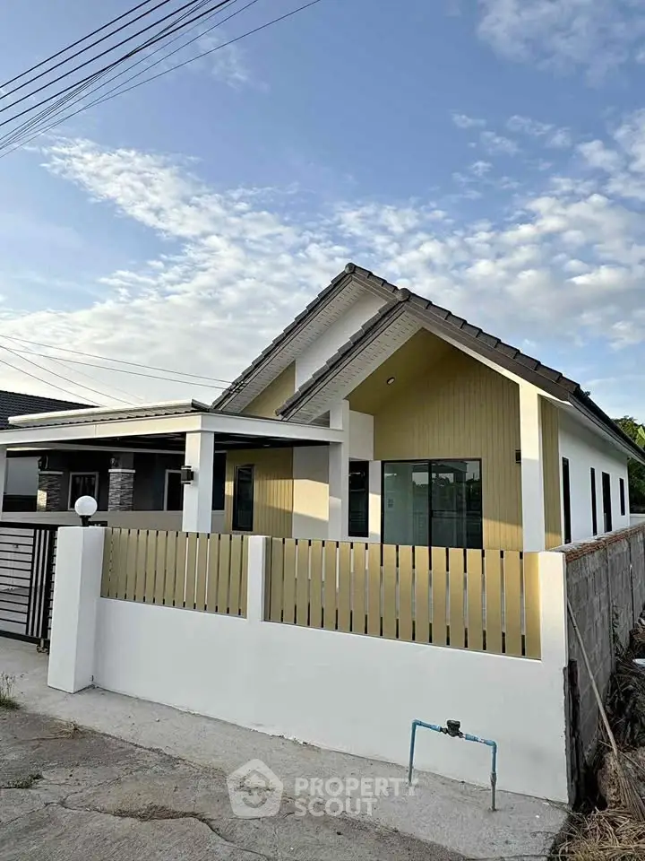 Charming single-story house with modern design and spacious front yard in a peaceful neighborhood.