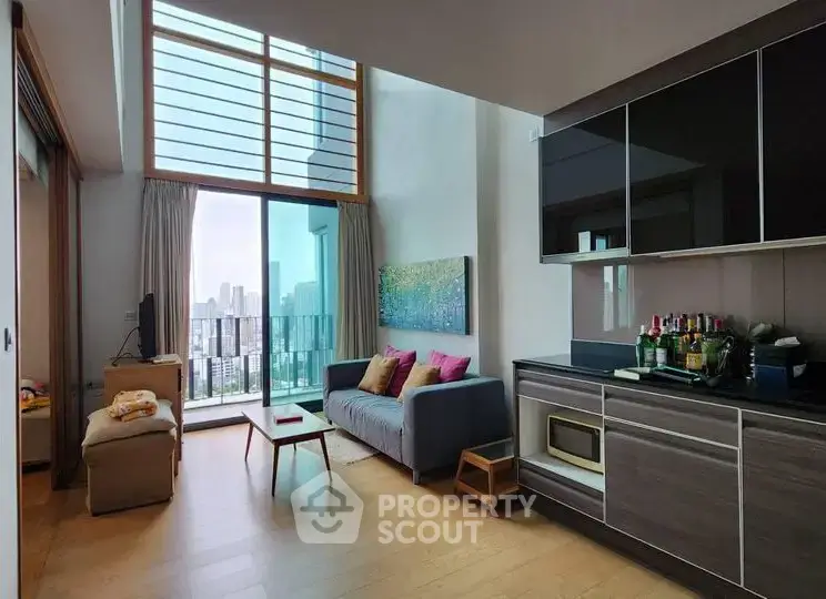 Modern living room with city view, high ceiling, and stylish decor in urban apartment.