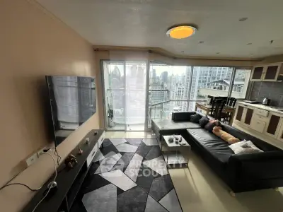 Modern living room with city view, sleek furniture, and open kitchen layout in high-rise apartment.