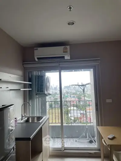 Modern kitchen with balcony view in urban apartment