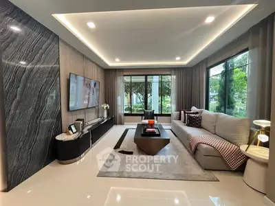 Luxurious modern living room with large windows and elegant decor