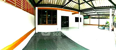 Spacious covered patio with modern design and garden view