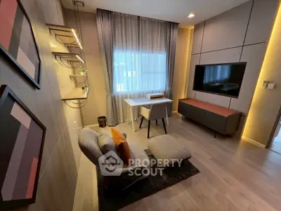 Modern living room with stylish furniture and large window, perfect for relaxation and entertainment.