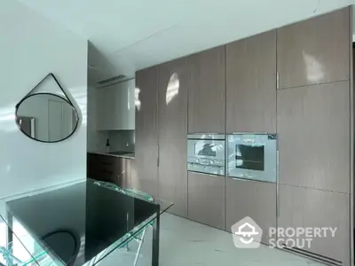 Modern kitchen with sleek cabinetry and built-in appliances in a bright, contemporary home.