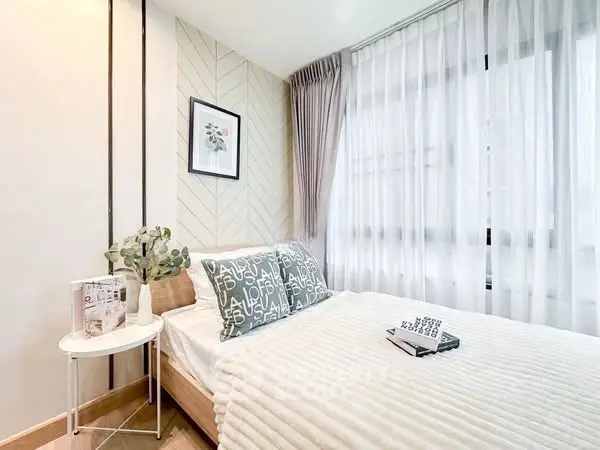Cozy bedroom with stylish decor and natural light