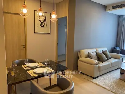 Modern living room with elegant dining area and cozy sofa