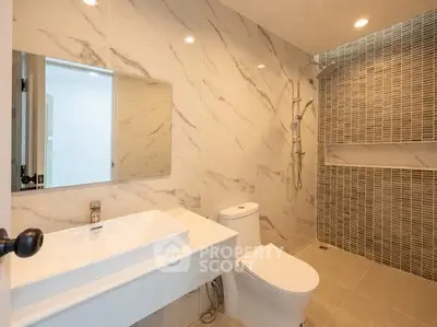Modern bathroom with elegant marble tiles and sleek fixtures