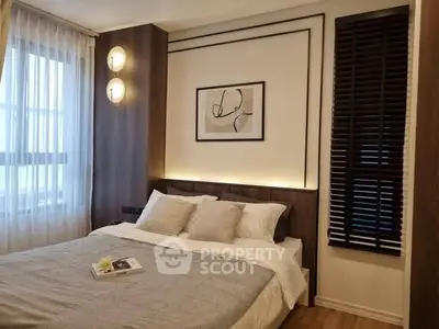 Modern bedroom with stylish decor and cozy ambiance, featuring elegant lighting and wooden accents.