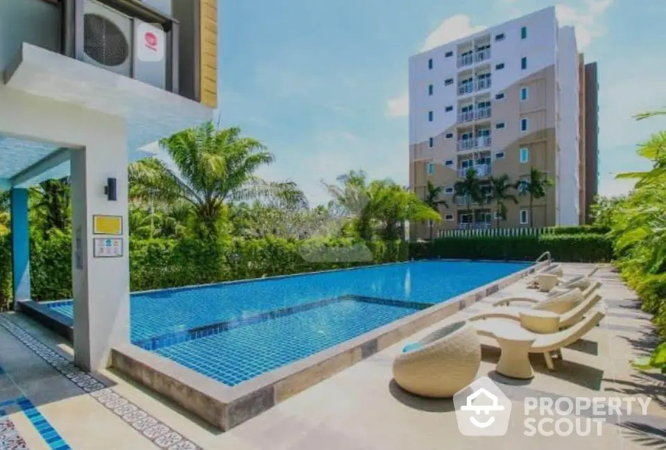 Luxurious apartment complex with stunning outdoor pool and modern amenities.