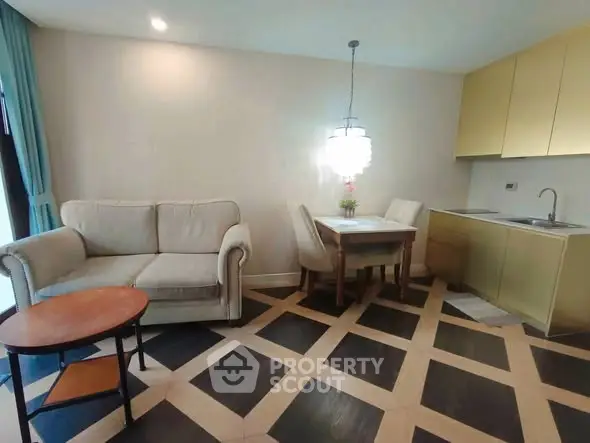 Modern living room with cozy sofa, dining area, and stylish kitchen in open layout.