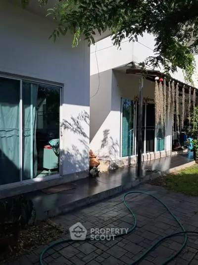 Charming residential property with modern exterior and lush garden space.