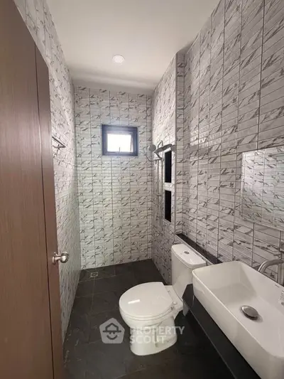 Modern bathroom with stylish tile design and sleek fixtures