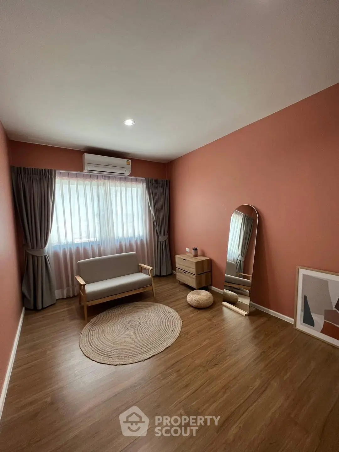 Cozy minimalist living room with wooden flooring and stylish decor