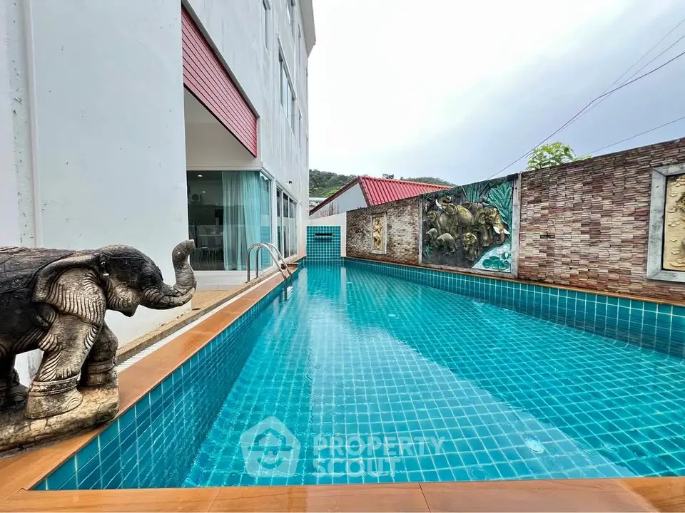 Luxurious private pool with artistic decor in modern residential property.