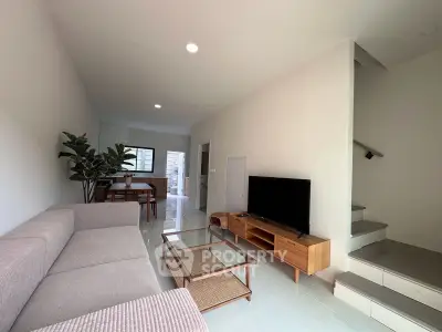 Modern living room with sleek furniture and open layout, perfect for contemporary living.