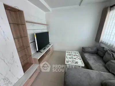 Cozy living room with modern TV unit and comfortable sofa