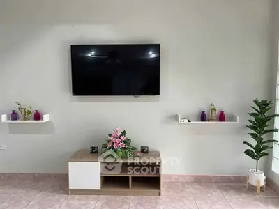 Modern living room with wall-mounted TV and stylish decor