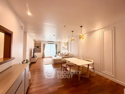 Spacious modern living room with elegant dining area and natural light