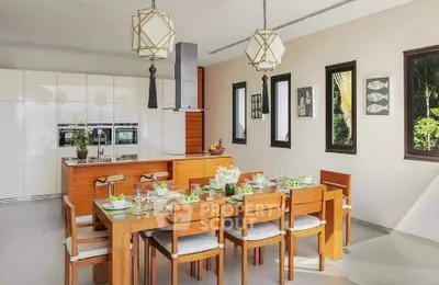 Modern kitchen with wooden dining set and sleek white cabinetry