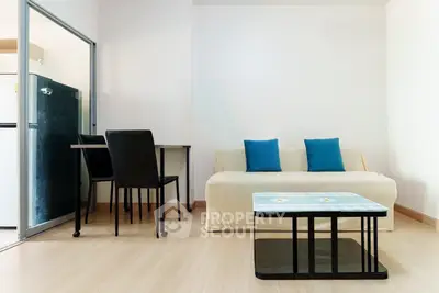 Modern living room with sleek furniture and open kitchen layout