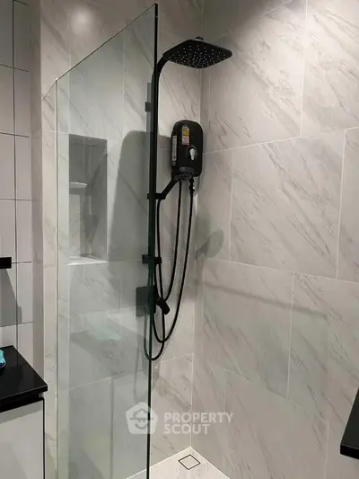 Modern bathroom with sleek shower design and glass partition