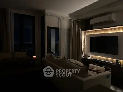Modern living room with ambient lighting and city view at night