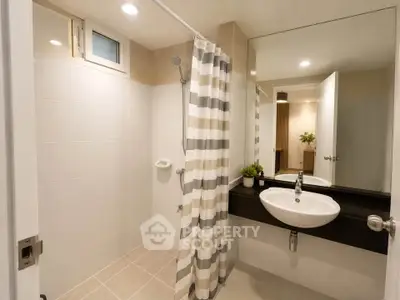 Modern bathroom with sleek design and stylish fixtures in a contemporary home.