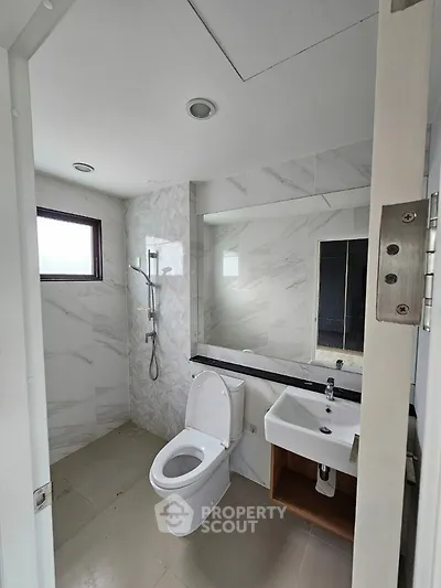 Modern bathroom with sleek fixtures and elegant marble tiles