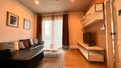 Modern living room with stylish furniture and natural light, perfect for relaxation and entertainment.