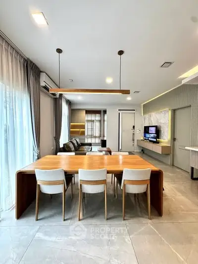 Modern living room with elegant dining area and stylish decor