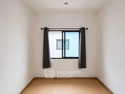 Minimalist empty room with window and curtains, perfect for customization.