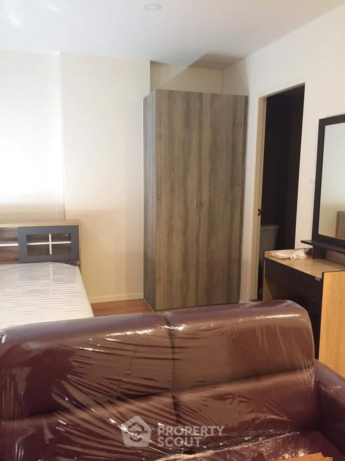 Cozy bedroom with modern furniture and sleek wardrobe design