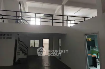 Spacious industrial-style interior with mezzanine and modern design