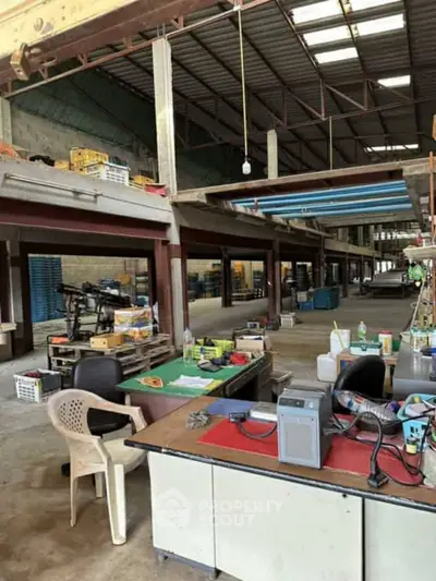 Spacious industrial warehouse with office space and high ceilings