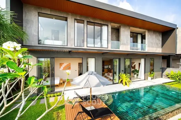 Luxurious modern villa with private pool and lush garden, perfect for relaxation and entertainment.