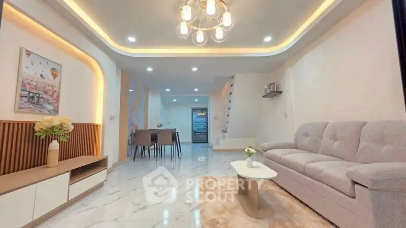Elegant modern living room with stylish lighting and marble flooring