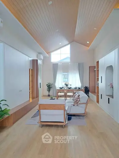 Spacious modern living room with high ceiling and elegant decor