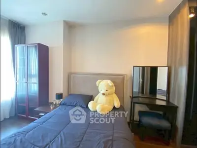 Cozy bedroom with plush teddy bear and modern furnishings