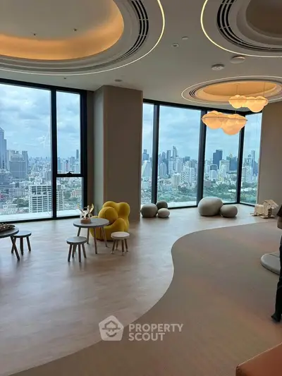 Luxurious high-rise living room with panoramic city views and modern decor.