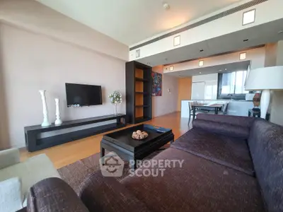 Spacious modern living room with open kitchen and stylish decor
