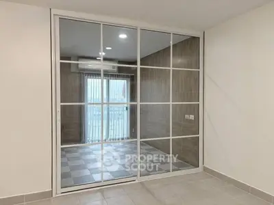 Modern interior with sliding glass doors and tiled flooring